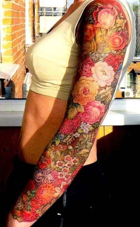 gorgeous flowers arm tattoo female